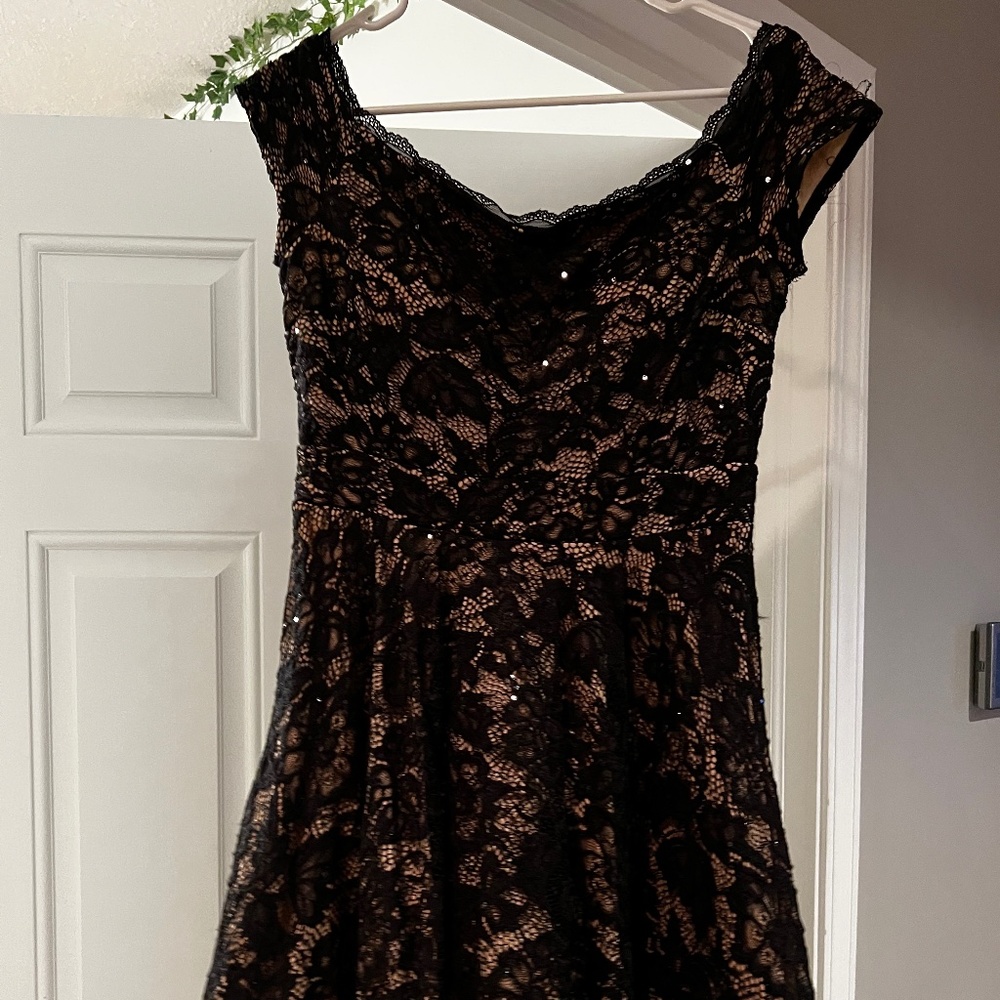 Black sequence off the shoulder